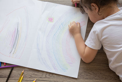 High angle view of boy on table at home