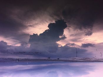 Scenic view of sea against sky during winter