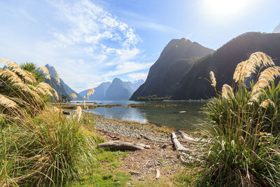 Scenic view of lake with mountain range in background