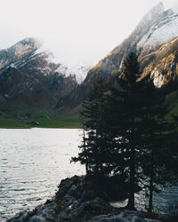 Scenic view of lake and mountains against sky