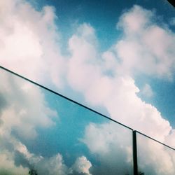 Low angle view of cables against sky