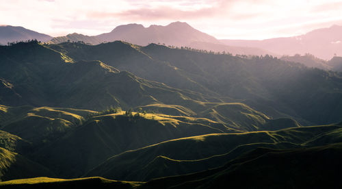 Scenic view of mountains against sky during sunset