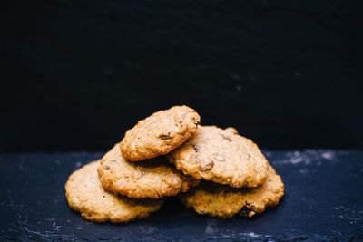 Close-up of cookies against black background