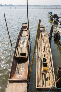 High angle view of wooden post in sea against sky