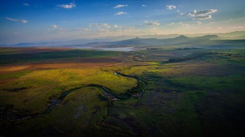 Aerial view of landscape against cloudy sky