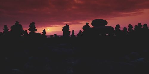 Silhouette of people at sunset