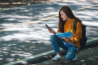 Young woman using mobile phone