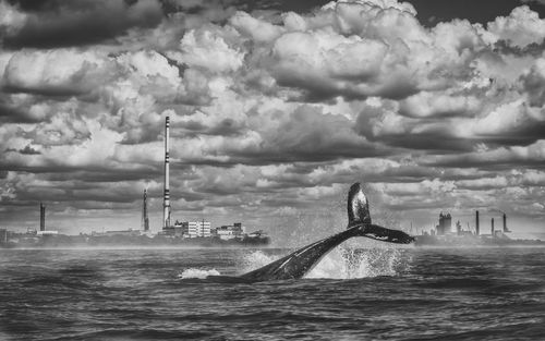 Scenic view of sea against storm clouds