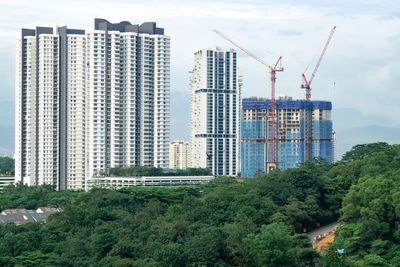 Modern buildings against sky in city