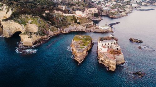 High angle view of sea by cliff