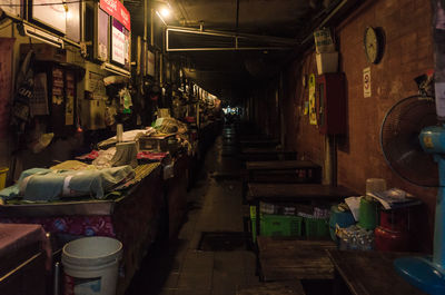 Illuminated tunnel at night
