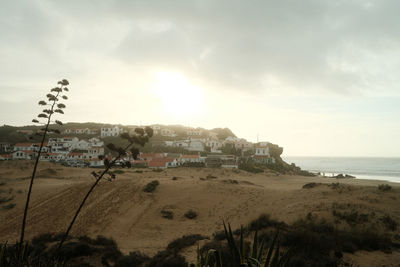 Scenic view of beach against sky