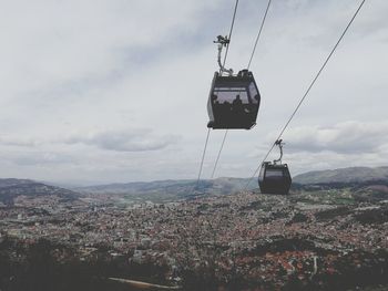 Overhead cable car against sky