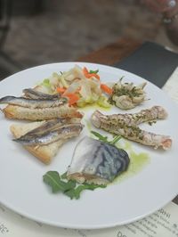 High angle view of fish served in plate on table
