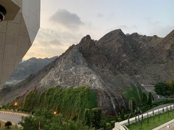 Scenic view of mountain against cloudy sky