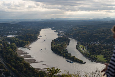 High angle view of river amidst cityscape against sky