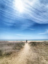 Man on beach against sky