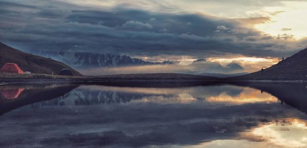 Scenic view of lake against sky during sunset