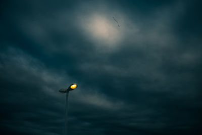 Low angle view of street light against sky