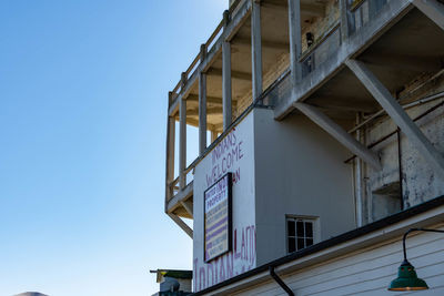 Low angle view of building against clear blue sky