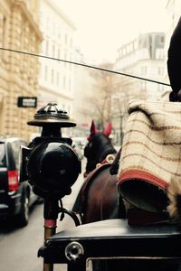 Woman looking at city street