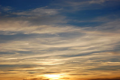 Low angle view of clouds in sky during sunset