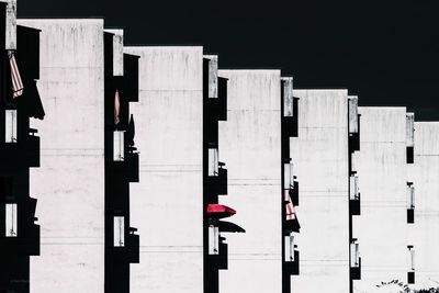 Low angle view of flag against buildings in city