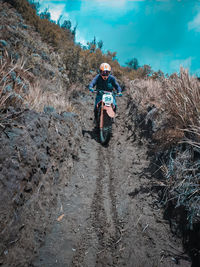 High angle view of man riding motorcycle on land