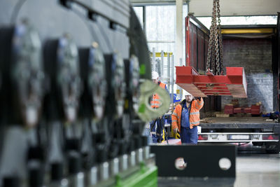 Industry, workers and indoor crane