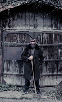 Man standing against wall