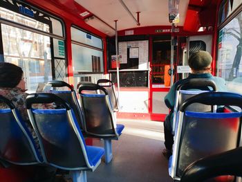 Rear view of people sitting in bus