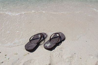 High angle view of shoes on beach