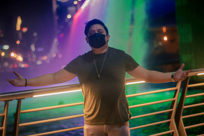 Full length of young man standing at night