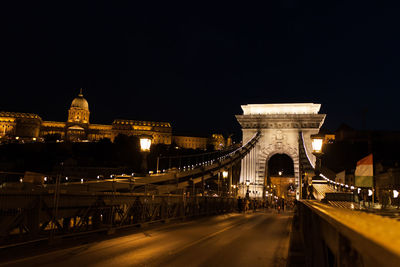 Illuminated suspension bridge at night