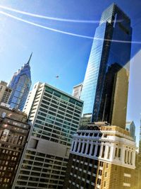 Low angle view of modern buildings against sky