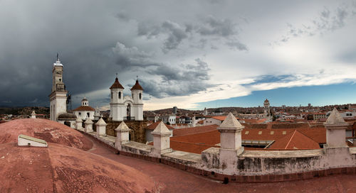 Buildings in city against sky