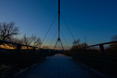 Bridge over river against clear sky