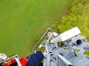 Low section of man working on grass