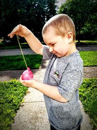 Cute girl holding plant