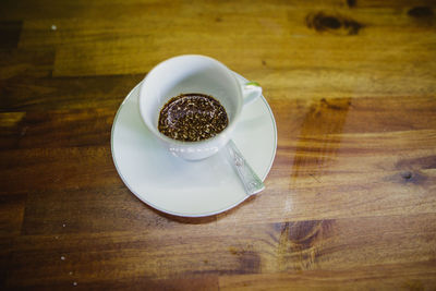 High angle view of coffee in plate on table