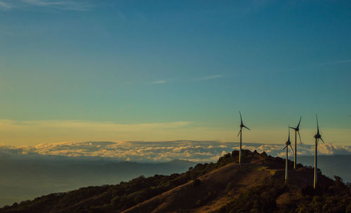 Scenic view of mountains against sky at sunset