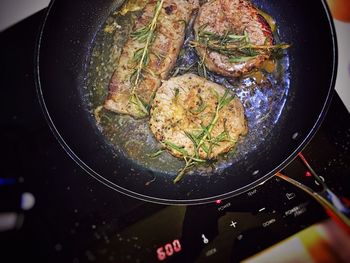 High angle view of meat in frying pan