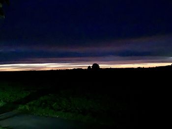 Silhouette landscape against sky during sunset