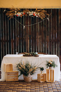 View of decoration on table against wooden wall