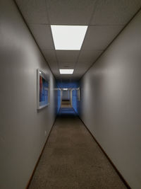 Illuminated corridor of building