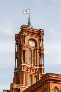 Low angle view of clock tower against sky