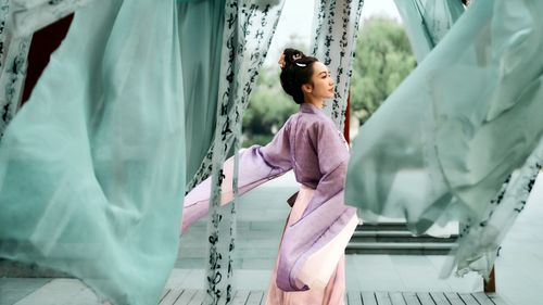 Low section of woman with arms raised