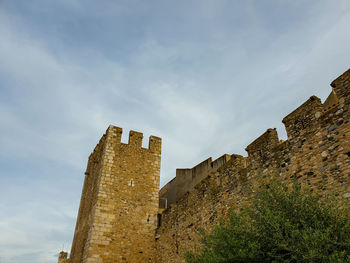 Low angle view of old building against sky