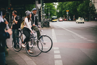 Man riding bicycle on city street