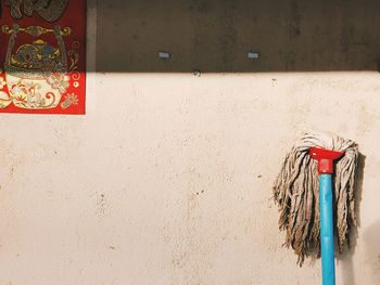 Clothes hanging on wall against building